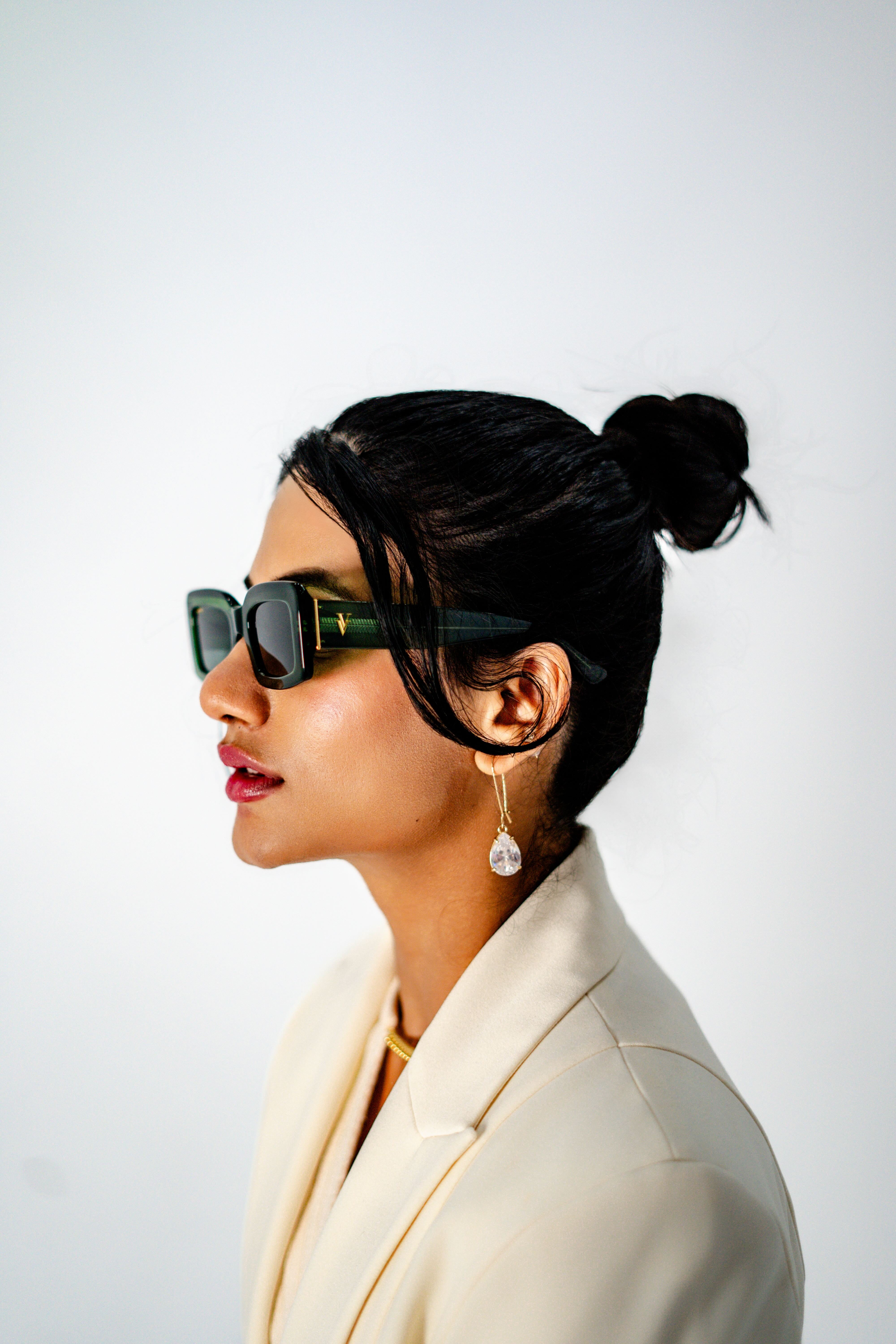 Model wearing Green acetate square sunglasses –side view