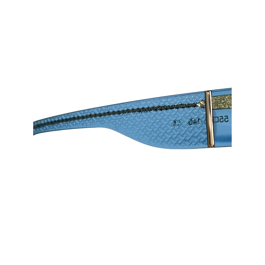 Close-up of Verre Noire gold logo on transparent blue sunglass temple