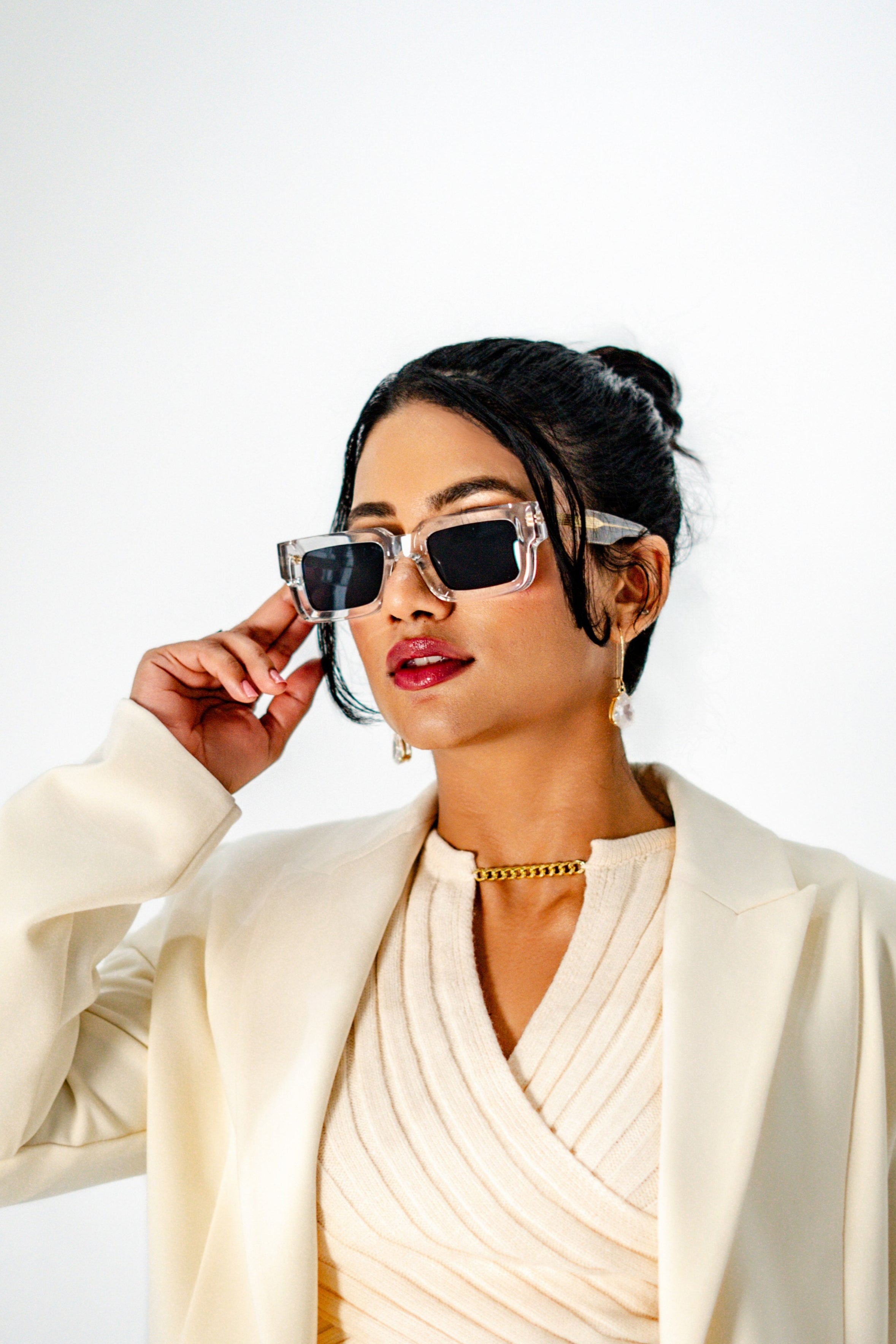 Model wearing Crystal Elite transparent frame sunglasses