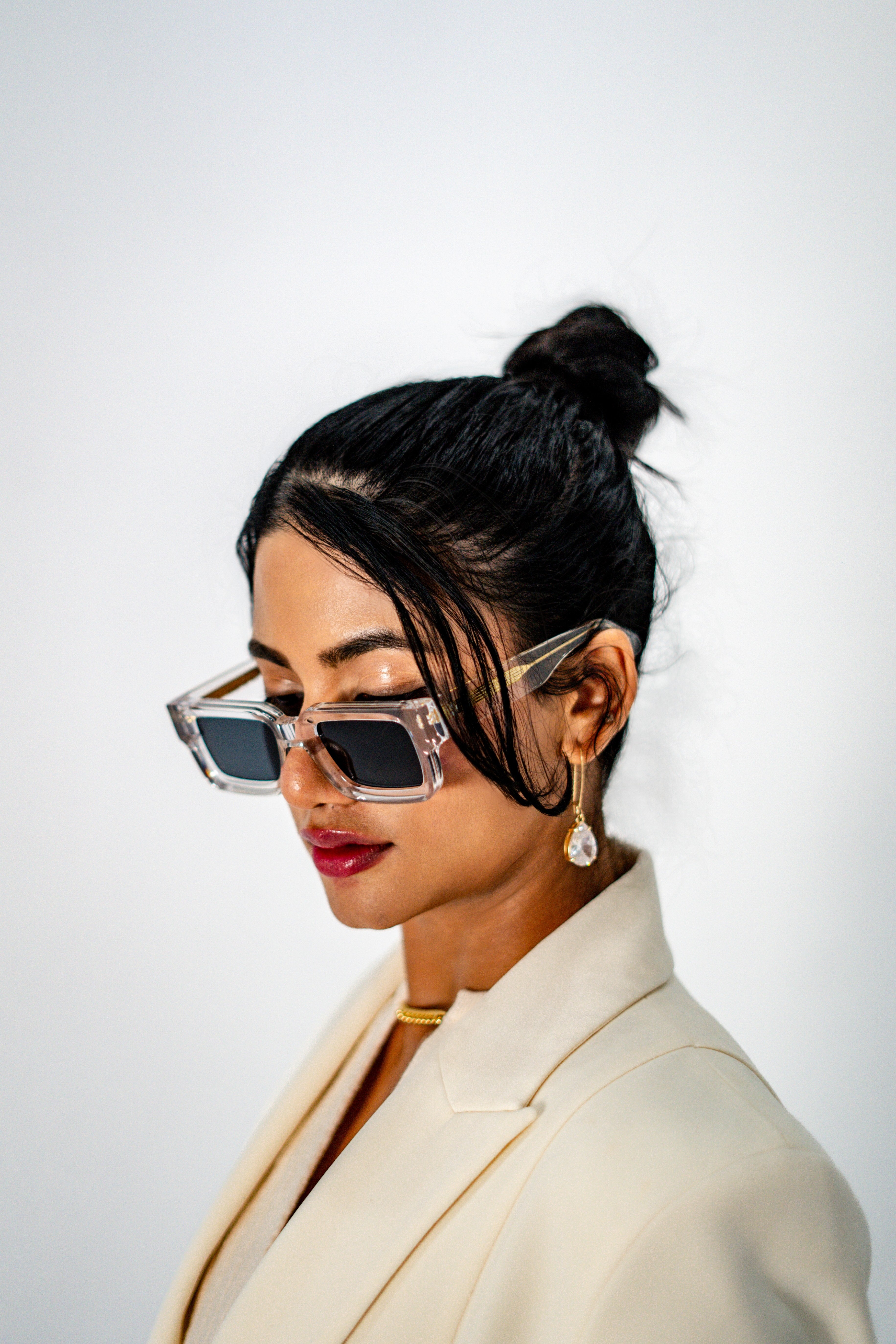Model wearing Crystal Elite transparent frame sunglasses