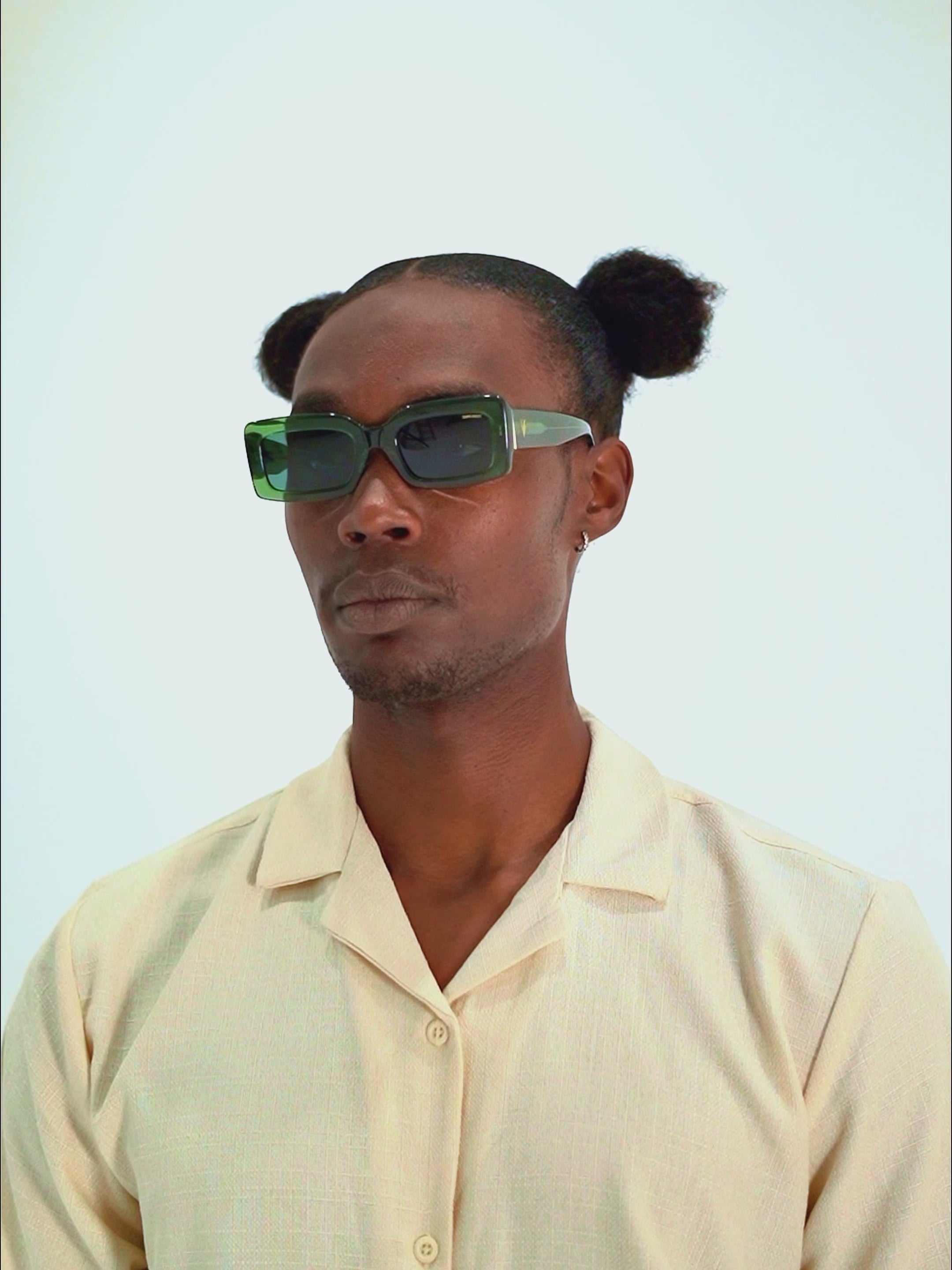 Model wearing Green Oasis sunglasses in olive green with soft frame